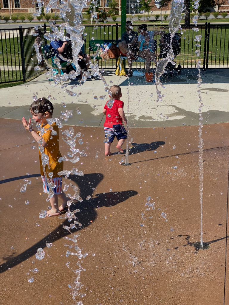 kids playing at a splash pad