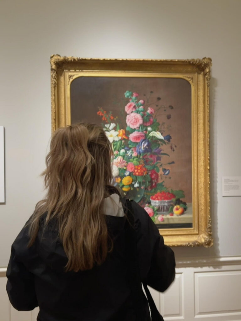 Photo of author looking at art in an art museum